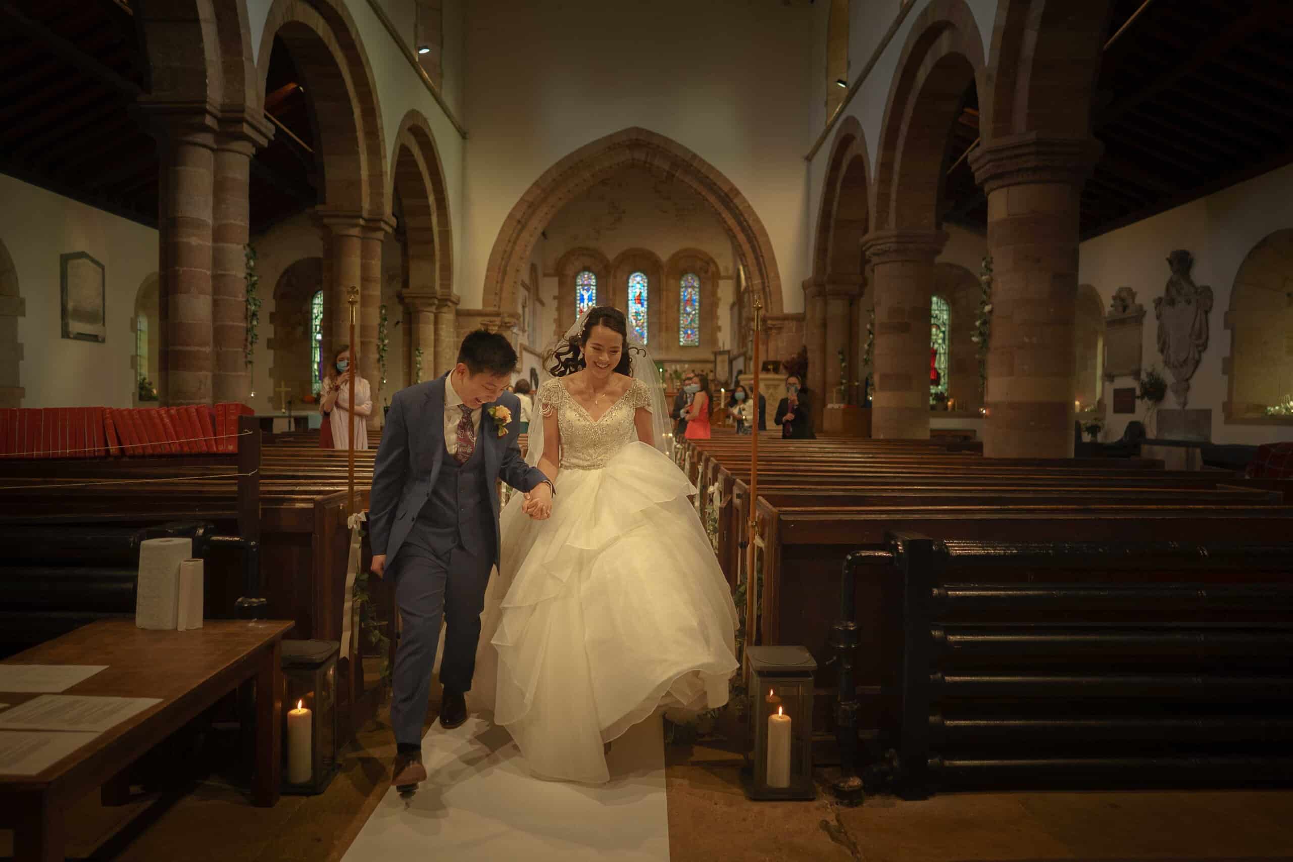 The bride and couple leave the Church after their shropshire wedding