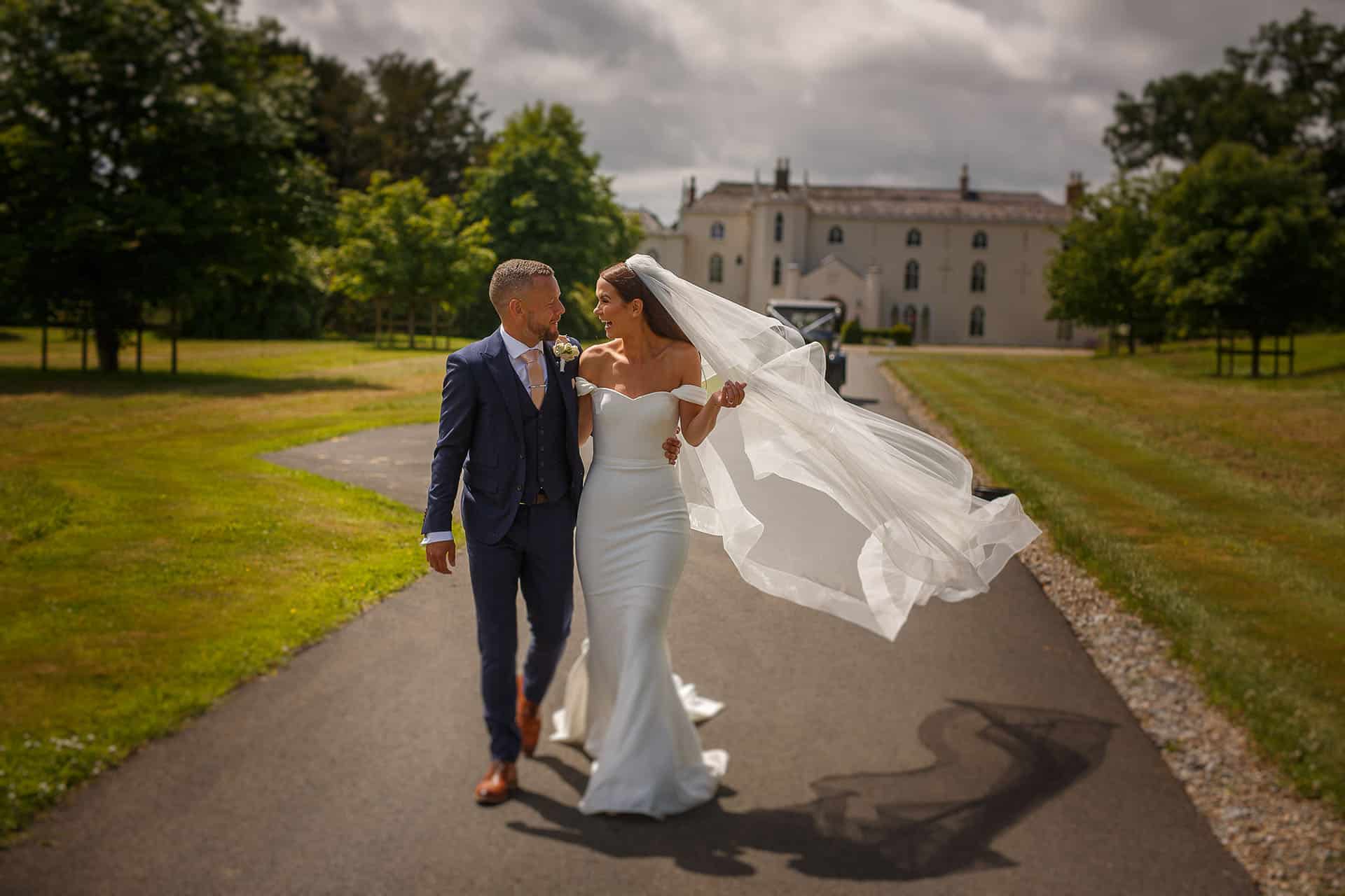 bride and groom take time out at combermere abbey wedding venue on the shropshire and cheshire border